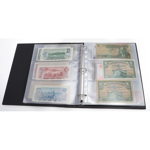 559 - TWO ALBUMS OF WORLD BANKNOTES. Approximately 132 World Banknotes to include notes from America, Keny... 