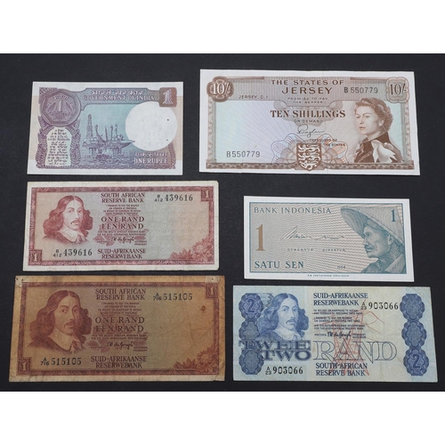 563 - A COLLECTION OF BANKNOTES TO INCLUDE GEORGE V UNITED KINGDOM NOTES AND OTHERS. A collection of bankn... 