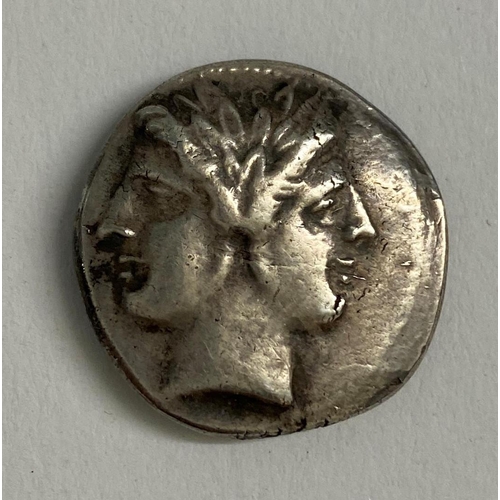 564 - A ROMAN REPUBLIC PERIOD SILVER DENARIUS. A Roman Republic silver denarius, obverse with a figure pos... 