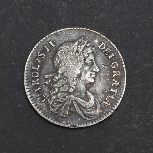 573 - A CHARLES II SHILLING, 1668. A George II Shilling, laureate and draped bust r. reverse with crucifor... 