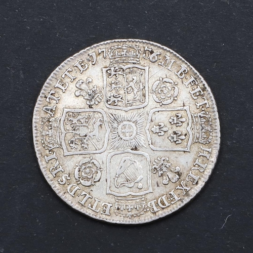 579 - A GEORGE II SHILLING, 1736. A George II Shilling, young laureate and draped bust l. reverse with ros... 