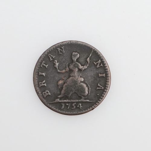 580 - A GEORGE II FARTHING, 1754. A George II Farthing, laureate and cuirassed bust l. Reverse seated figu... 