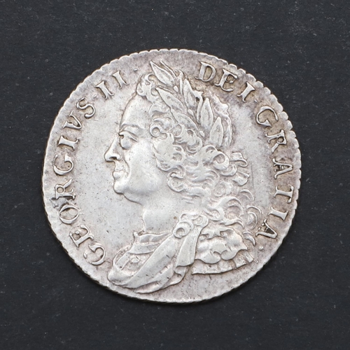 581 - A GEORGE II SHILLING, 1758. A George II Shilling, old laureate and draped bust l. Reverse with plain... 