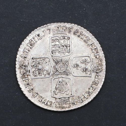 581 - A GEORGE II SHILLING, 1758. A George II Shilling, old laureate and draped bust l. Reverse with plain... 