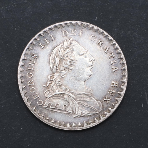 584 - A GEORGE III BANK TOKEN, 1811. A George III bank Token, One Shilling and six pence, laureate bust in... 