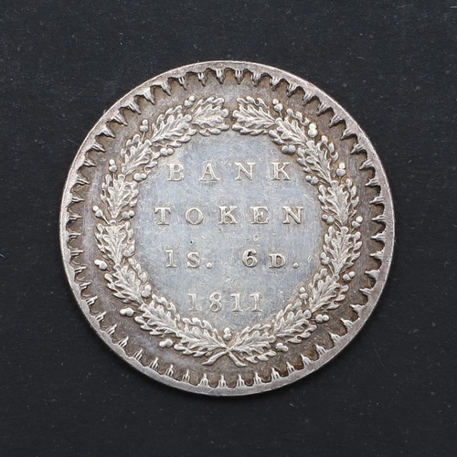 584 - A GEORGE III BANK TOKEN, 1811. A George III bank Token, One Shilling and six pence, laureate bust in... 