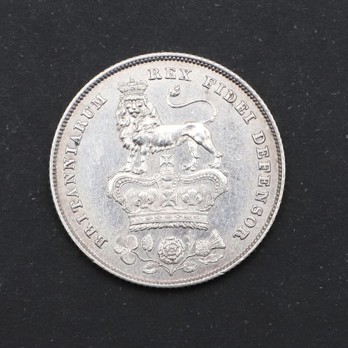 591 - A GEORGE IV SHILLING, 1825. A George IV Shilling, bare head l. dated 1825, reverse with Lion on crow... 