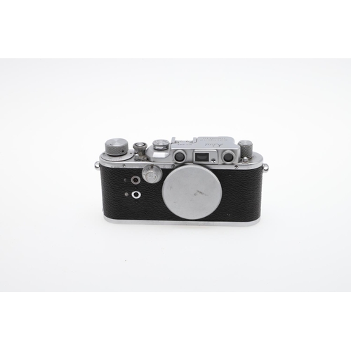 519 - REID & SIGRIST REID RANGEFINDER CAMERA & LEICA CASE. Circa 1950's, the camera with a chrome and blac... 