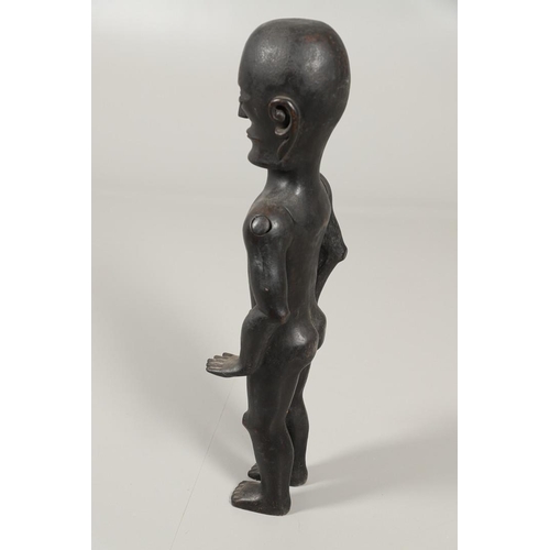 527 - TRIBAL INTEREST - A LARGE CARVED ARTICULATED FIGURE. A large carved hardwood male figure, with artic... 