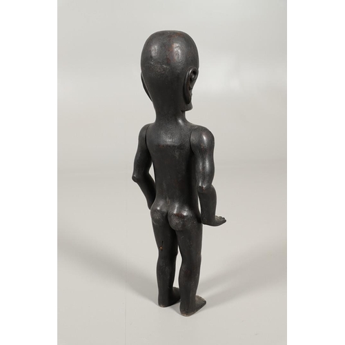 527 - TRIBAL INTEREST - A LARGE CARVED ARTICULATED FIGURE. A large carved hardwood male figure, with artic... 