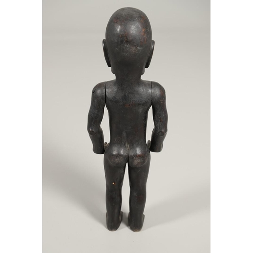 527 - TRIBAL INTEREST - A LARGE CARVED ARTICULATED FIGURE. A large carved hardwood male figure, with artic... 