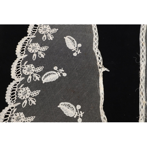 537 - QUEEN VICTORIA INTEREST - HONITON LACE BERTHA. A 19thc Honiton lace bertha, mounted on a piece of bl... 