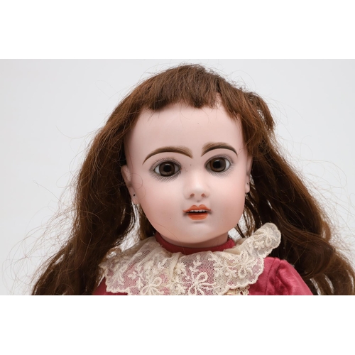 538 - FRENCH JUMEAU BISQUE HEAD DOLL. The large doll with fixed almond glass eyes, open mouth and pierced ... 