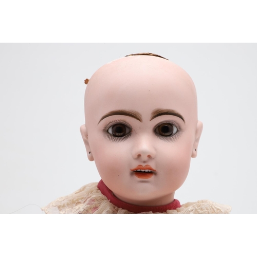 538 - FRENCH JUMEAU BISQUE HEAD DOLL. The large doll with fixed almond glass eyes, open mouth and pierced ... 