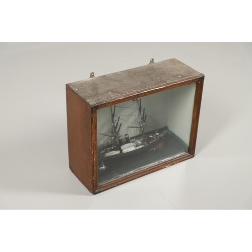 544 - CASED ANTIQUE MODEL BOAT. A wooden and painted model of a boat or schooner, with two masts and one w... 