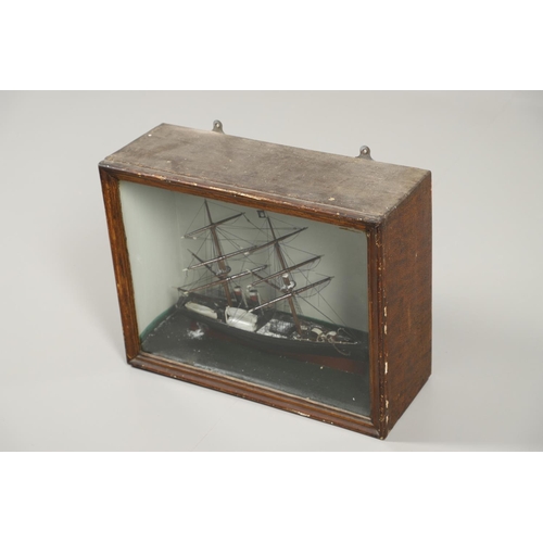 544 - CASED ANTIQUE MODEL BOAT. A wooden and painted model of a boat or schooner, with two masts and one w... 