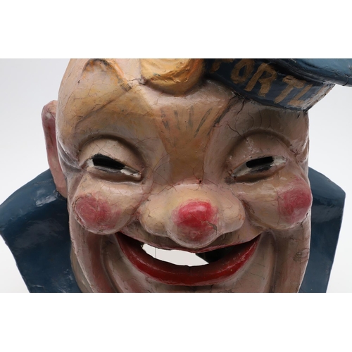 555 - FAIRGROUND INTEREST - LARGE PAPIER MACHE SAILOR 'HMS PORTLAND'. A large painted papier mache head of... 