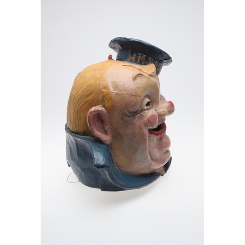 555 - FAIRGROUND INTEREST - LARGE PAPIER MACHE SAILOR 'HMS PORTLAND'. A large painted papier mache head of... 