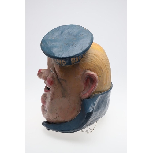 555 - FAIRGROUND INTEREST - LARGE PAPIER MACHE SAILOR 'HMS PORTLAND'. A large painted papier mache head of... 