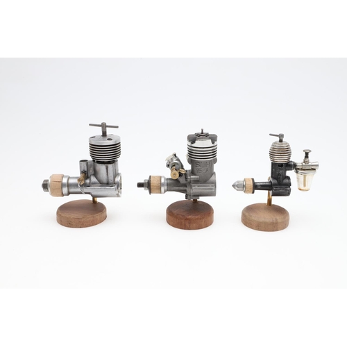 568 - AEROPLANE & MARINE MODEL ENGINES. A mixed lot including seven small engines mounted on wooden plinth... 