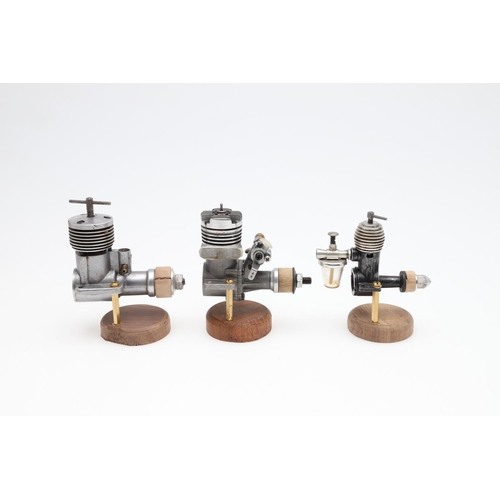 568 - AEROPLANE & MARINE MODEL ENGINES. A mixed lot including seven small engines mounted on wooden plinth... 