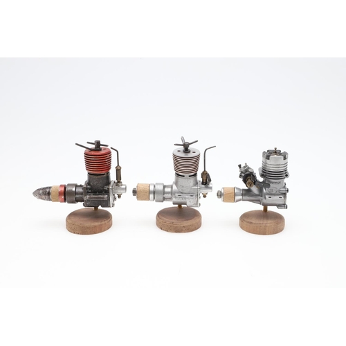 568 - AEROPLANE & MARINE MODEL ENGINES. A mixed lot including seven small engines mounted on wooden plinth... 