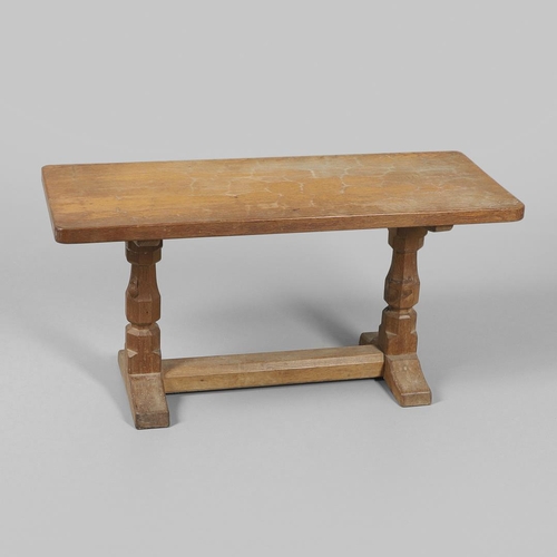 654 - ROBERT THOMPSON OF KILBURN - MOUSEMAN COFFEE TABLE. With a rectangular shaped adzed top, supported o... 