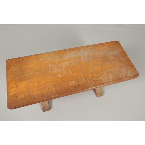 654 - ROBERT THOMPSON OF KILBURN - MOUSEMAN COFFEE TABLE. With a rectangular shaped adzed top, supported o... 