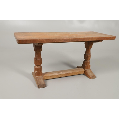 654 - ROBERT THOMPSON OF KILBURN - MOUSEMAN COFFEE TABLE. With a rectangular shaped adzed top, supported o... 