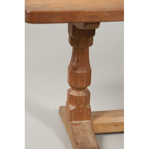 654 - ROBERT THOMPSON OF KILBURN - MOUSEMAN COFFEE TABLE. With a rectangular shaped adzed top, supported o... 