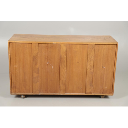 660 - VINTAGE ERCOL ELM SIDEBOARD. A vintage light elm sideboard with two door cupboard and internal shelf... 