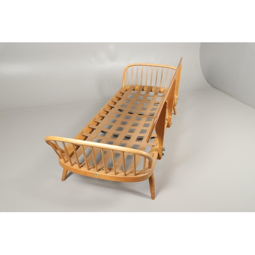 662 - VINTAGE ERCOL DAY BED. A vintage elm and beech day bed or couch, with a single plank back and spindl... 