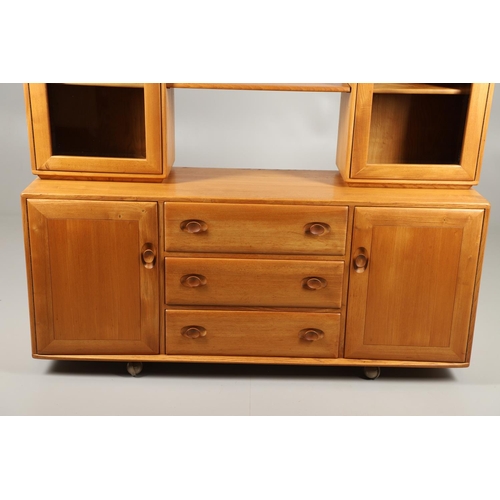 668 - ERCOL ELM SIDEBOARD/DISPLAY CABINET. From the Windsor range, a light elm side sideboard with three c... 