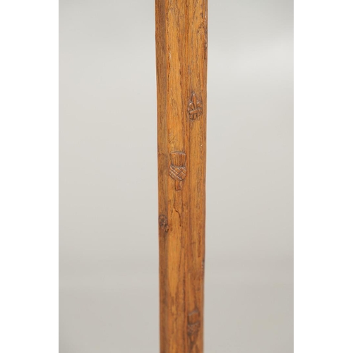 669 - ARTS & CRAFTS OAK STANDARD LAMP. In the style of Robert Thompson of Kilburn (Mouseman), of octagonal... 