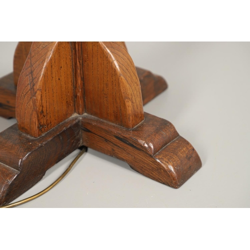 669 - ARTS & CRAFTS OAK STANDARD LAMP. In the style of Robert Thompson of Kilburn (Mouseman), of octagonal... 