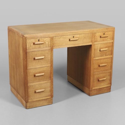 672 - HEALS OAK PEDESTAL DESK. The oak desk with three drawers above three larger drawers to each side, ma... 