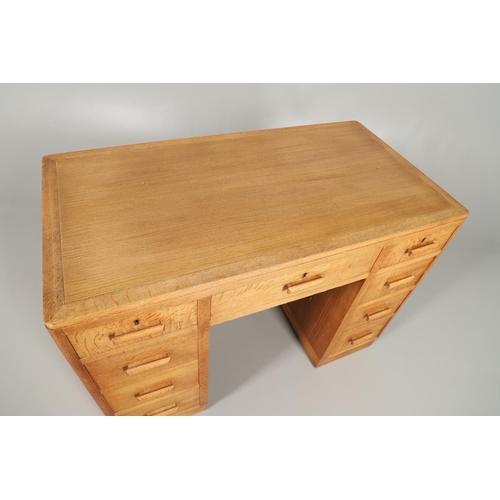 672 - HEALS OAK PEDESTAL DESK. The oak desk with three drawers above three larger drawers to each side, ma... 