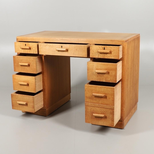 672 - HEALS OAK PEDESTAL DESK. The oak desk with three drawers above three larger drawers to each side, ma... 