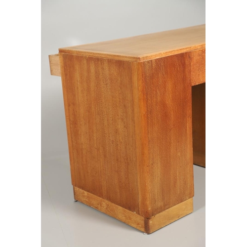 672 - HEALS OAK PEDESTAL DESK. The oak desk with three drawers above three larger drawers to each side, ma... 