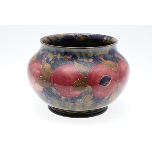 687 - EARLY MOORCROFT POMEGRANATE & MOORCROFT VASE. A early jardiniere of globular form in the pomegranate... 