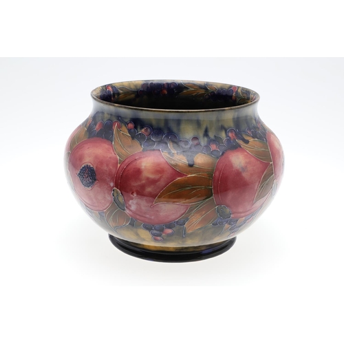 687 - EARLY MOORCROFT POMEGRANATE & MOORCROFT VASE. A early jardiniere of globular form in the pomegranate... 