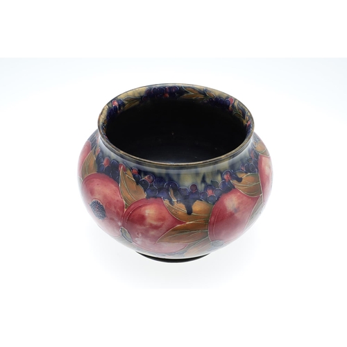 687 - EARLY MOORCROFT POMEGRANATE & MOORCROFT VASE. A early jardiniere of globular form in the pomegranate... 