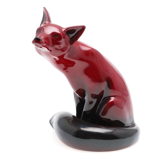 699 - ROYAL DOULTON FLAMBE MODEL OF A SEATED FOX. A large Royal Doulton flambe model of a seated Fox, with... 