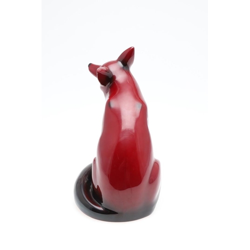 699 - ROYAL DOULTON FLAMBE MODEL OF A SEATED FOX. A large Royal Doulton flambe model of a seated Fox, with... 