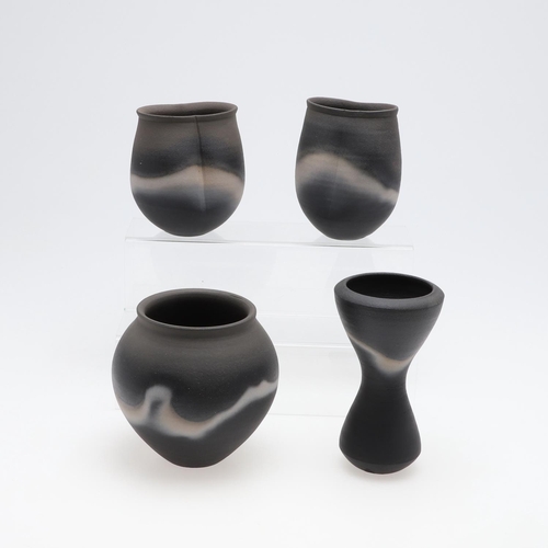 706 - JOHN LEACH (1939-2021) - BLACK BURNISHED STUDIO POTTERY VASES. Four various stoneware vases with a b... 