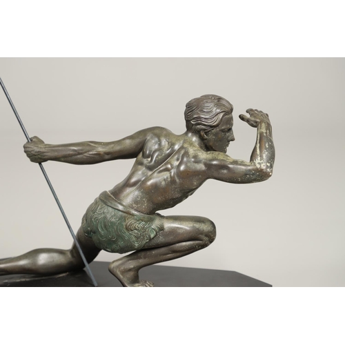 716 - JEAN DE RONCOURT - FRENCH ART DECO SPELTER FIGURE. A patinated spelter figure of a hunter holding a ... 