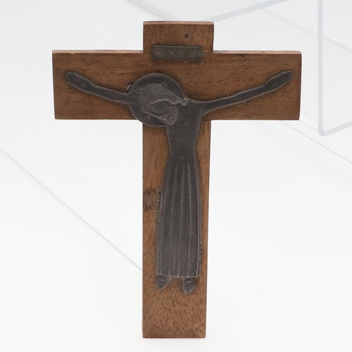 721 - DUNSTAN PRUDEN (1906-1974) - SILVER & WOODEN CRUCFIX. A silver figure of Christ mounted on a wooden ... 