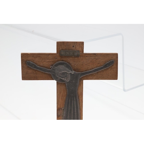 721 - DUNSTAN PRUDEN (1906-1974) - SILVER & WOODEN CRUCFIX. A silver figure of Christ mounted on a wooden ... 