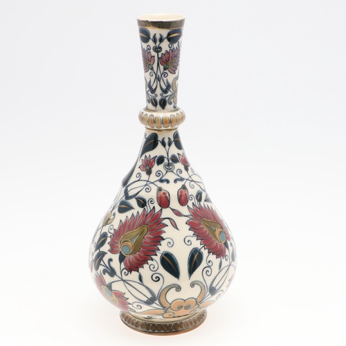 722 - ZSOLNAY PECS VASE. A bottle shaped vase painted with a Persian style design of flowers and leaves. M... 