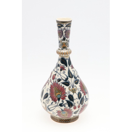 722 - ZSOLNAY PECS VASE. A bottle shaped vase painted with a Persian style design of flowers and leaves. M... 